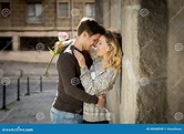 Candid Portrait of Beautiful European Couple with Rose in Love Kissing ...