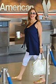 Baby on board! Pregnant Kelly Preston looks radiant as she jets out of ...