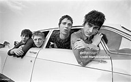 Group portrait of British rock band These Animal Men leaning out of ...