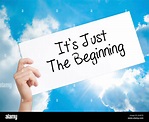 It's Just The Beginning Sign on white paper. Man Hand Holding Paper ...