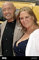 US actor Terry O'Quinn and his wife Lori pose in front of a helicopter ...