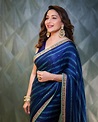 Madhuri Dixit looks effortlessly graceful in a blue saree!