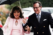 Who is Dame Joan Collins' husband Percy Gibson?