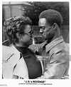 Glynn Turman hugging an unknown actress in a scene from the film ...