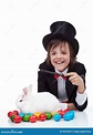 The Magic of Easter - Happy Magician Boy and Grumpy Rabbit Stock Image ...