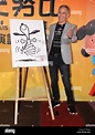 American director Steve Martino poses with a cartoon of Snoopy at a ...