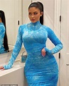 Kylie Jenner flaunts curvaceous figure in clinging aqua dress for ...