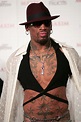 Dennis Rodman's tattoo collection includes a very graphic one