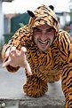 Photographer Persuades Strangers to Strike a Pose Wearing a Tiger Suit