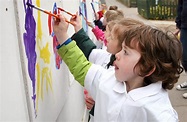 Children-painting-wall - Wivenhoe Park Day Nursery