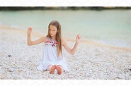 Cute little girl at beach during | Nature Stock Photos ~ Creative Market