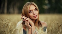 Girl Model Is Sitting In Dry Grass Field With Blur Background Posing ...