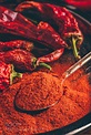 Spoonful of ground red chili pepper Spoonful of ground red chili pepper ...