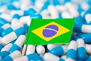 Premium Photo | Brazilian healthcare system. flag of brazil on piles of ...