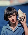 ♡♥Ringo Starr listens to the sound the wind makes inside a seashell ...