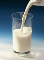 Pouring milk into glass — Milk Stream, opaque glass - Stock Photo ...