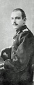 an old black and white photo of a man in uniform
