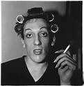 ARTPEDIA - Diane Arbus - A young man in curlers at home on...