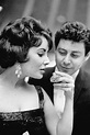 Elizabeth Taylor and Eddie Fisher attend the premiere of Smellovision ...