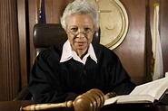 Portrait of a senior female judge with book in courtroom | Molnar ...