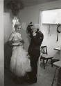 Lou Walters stands with unidentified showgirl backstage at his Miami ...