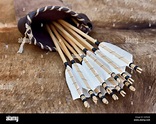 Ancient quiver with arrows over the table Stock Photo - Alamy