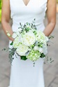 Wedding bridal bouquet featuring white hydrangeas, roses, and greenery ...