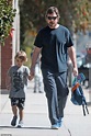 Christian Bale is every inch the doting dad as he holds hands with son ...