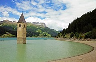 The partly submerged church bell tower of Lake Reschen, South Tyrol ...