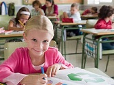 Girl in classroom - Stock Photo - Dissolve