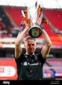 Luton Town manager Rob Edwards celebrates with the trophy after winning ...