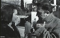 Italian film director Federico Fellini talking with actress Geneviève ...