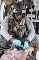 Medic from 101st Combat Aviation Brigade Medevac Company attending to ...