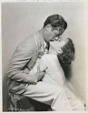 Joan Crawford Kissing Robert Montgomery by Bettmann