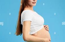 nacked woman belly alamy posing stock pregnant haired pretty brown young