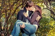 couple kissing young romantic happy attractive outdoors stock