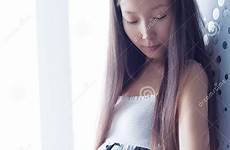 pregnant young asian woman stock