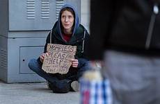 homeless woman toronto homelessness cbc sign help canada holding ontario invest 90m deal years over reads sits sidewalk donnelly david