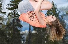 trampoline jumping girl down young alamy teenage upside action stock freeze model release