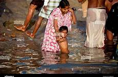 bathing river ganges child india boy mother indian alamy varanasi stock