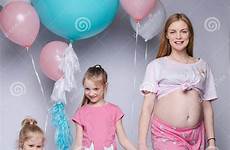 pregnant daughters looking two their mother cheerful her bellies gorgeous funny belly femininity