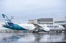 westjet dreamliner first revenue flight launches heading carrying alta calgary pearson guests toronto airport aircraft international time