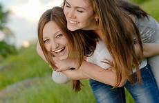 fun teen friends having two girl laughing outdoors spring summer preview