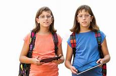 handicapped twin two students twins embracing outdoors stock tablets notebooks field young green cute girl