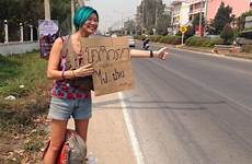 hitchhikes across woman just