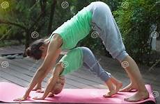 yoga daughter mother practicing exercise outdoors doing lifestyle stock preview