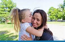 daughter mother kissing stock summer