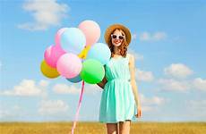 balloons holds enjoying smiling colorful air woman summer happy young blue meadow sky stock pretty
