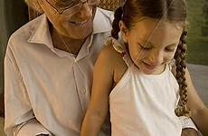 granddaughter reading grandfather fotosearch