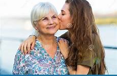 grandma young woman kissing her preview